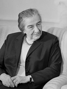 Golda Meir, the first member of Warhol's minyan, takes a seat and waits for the others.